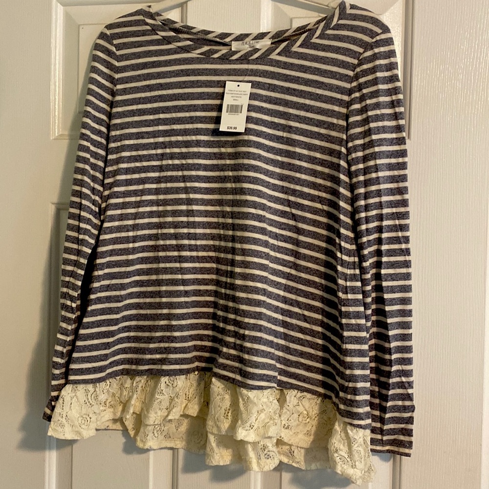 Striped top with off white lace bottom trim.